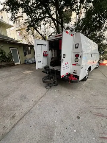 Magnet Plumbing service vehicle on-site for Grease Trap Cleaning in San Antonio